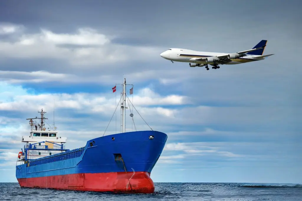 A shipping freighter at sea with a freight plane flying overhead. This is to represent ‘Air Freight Vs Sea Freight Costs: How to Choose the Most Effective Option’